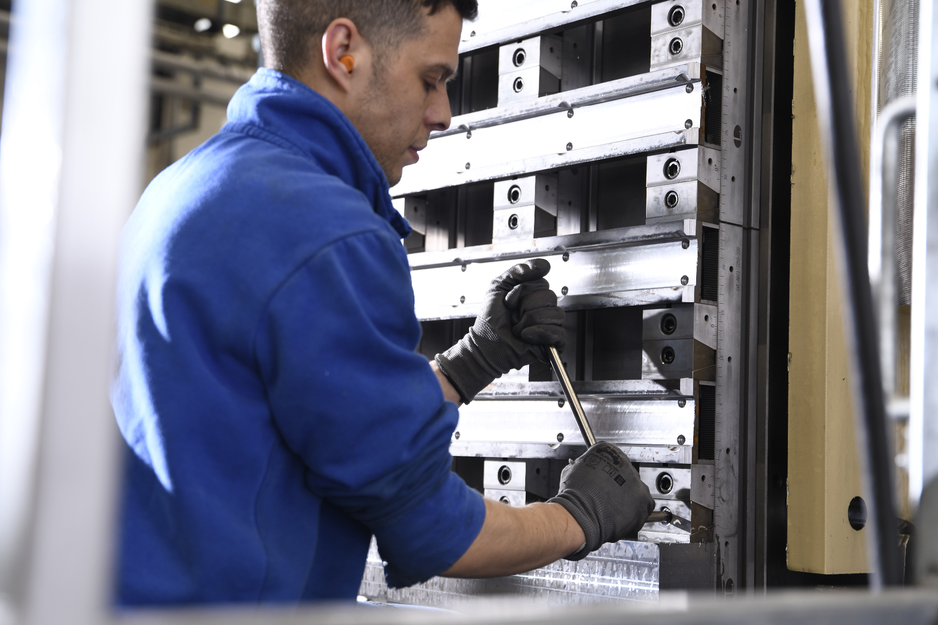 Pellanda technician securing a component inside a CNC machine