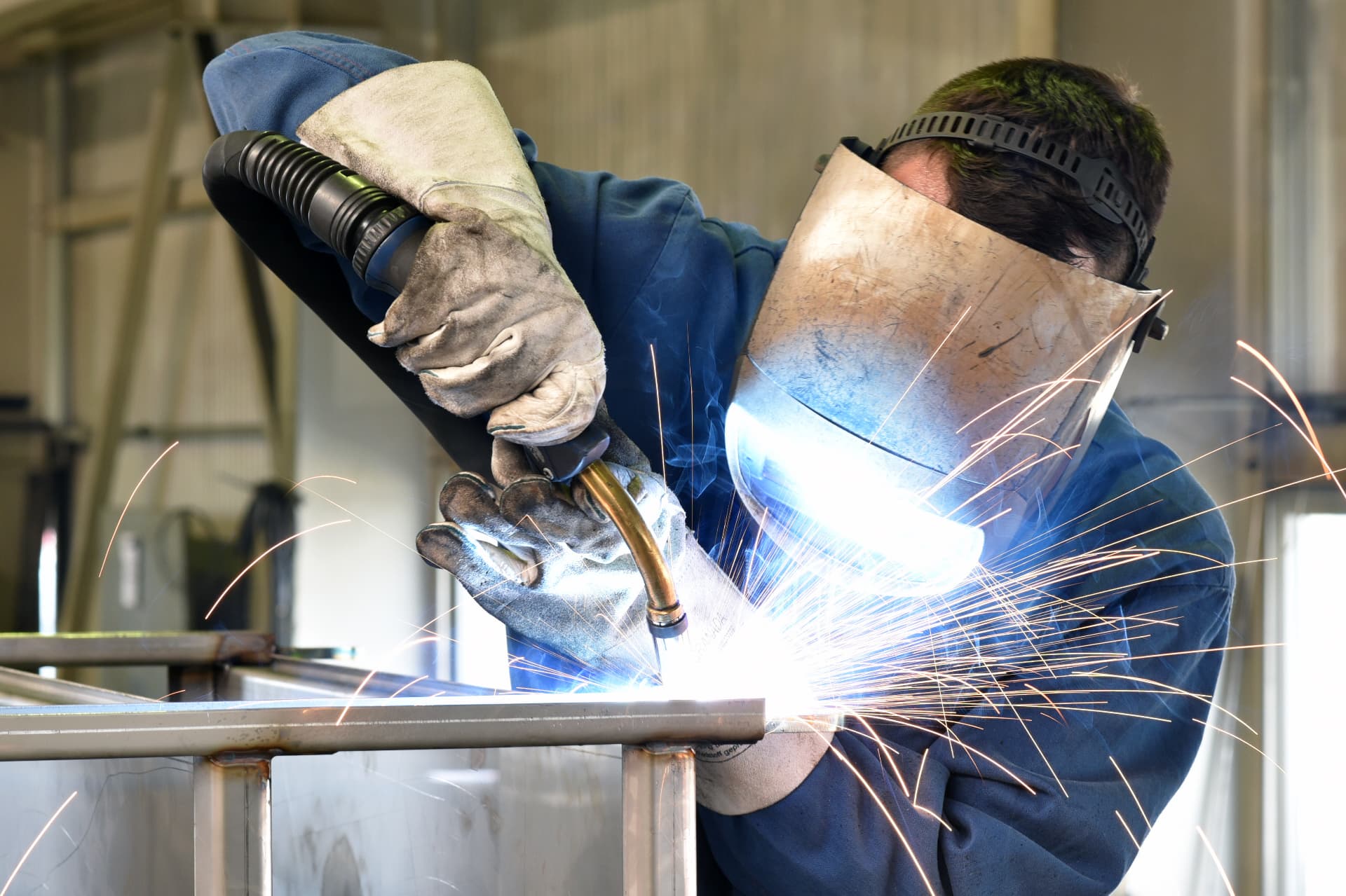 Certified welder joining a steel frame in the Pellanda workshop