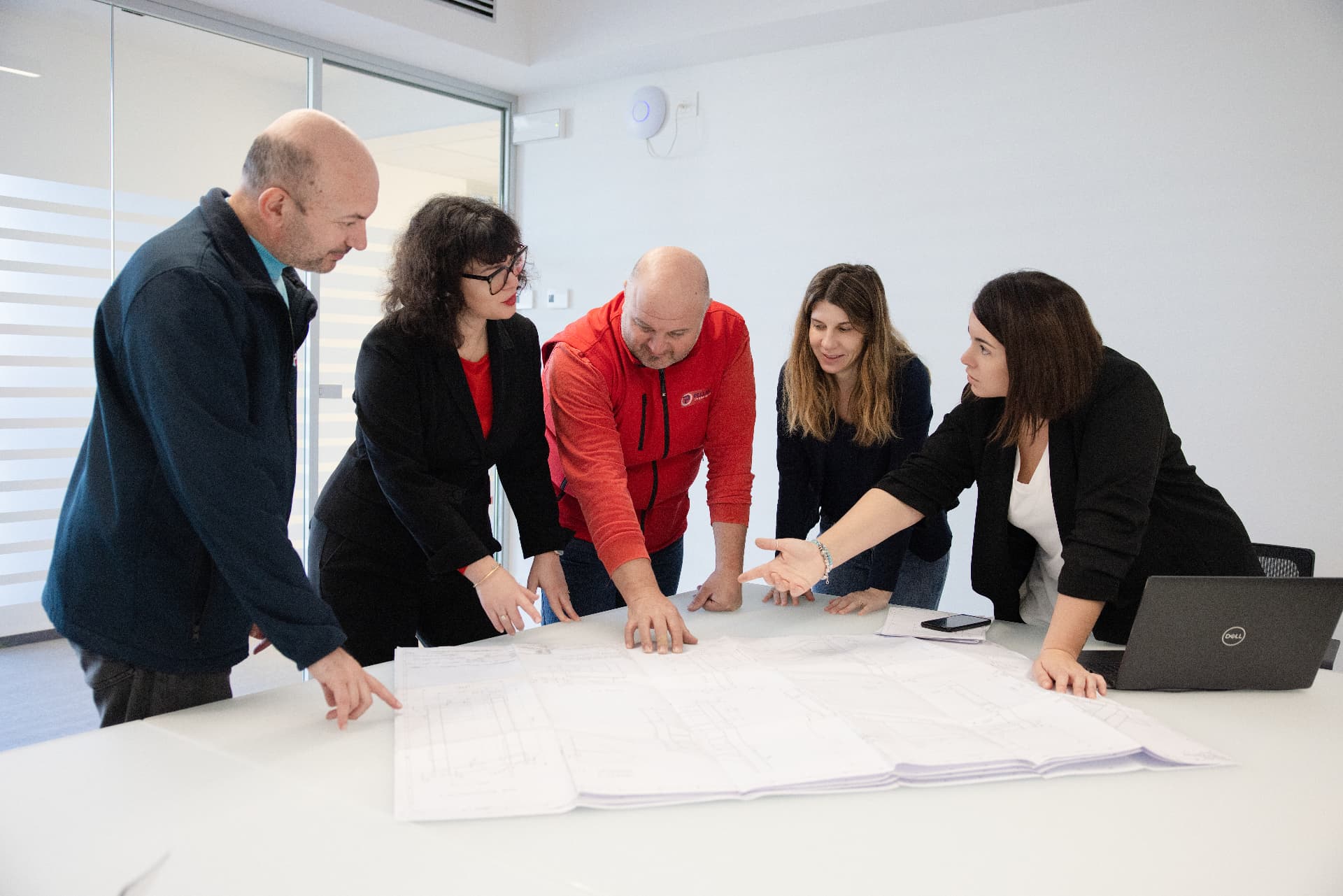 Pellanda engineering team reviewing technical drawings