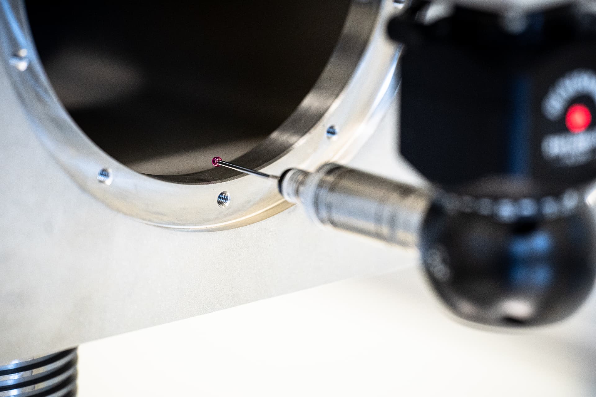 CMM probe with ruby stylus measuring the inside of a precision machined bore